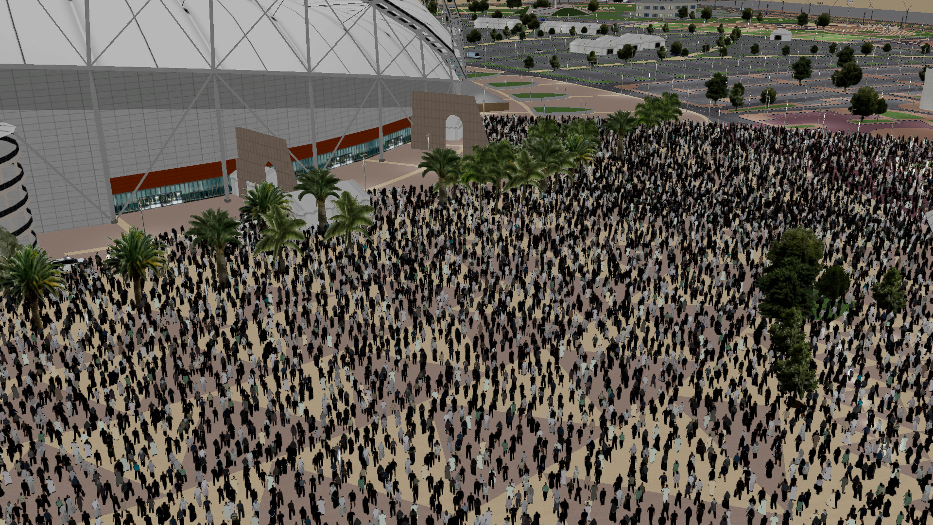Large crowds are moving outside a sporting stadium, observed by a police drone in the ADMS Flight Training Simulator.
